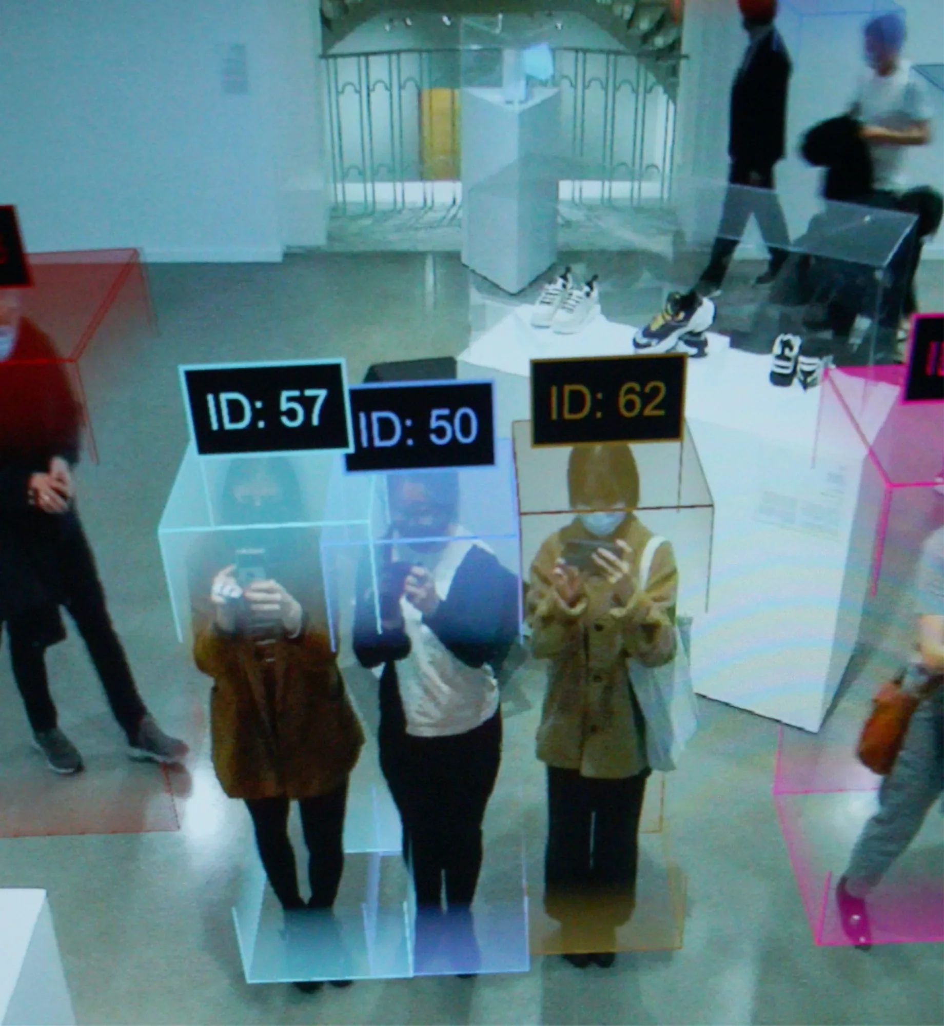 Visitors in the exhibition space, each already carrying an id and a colour